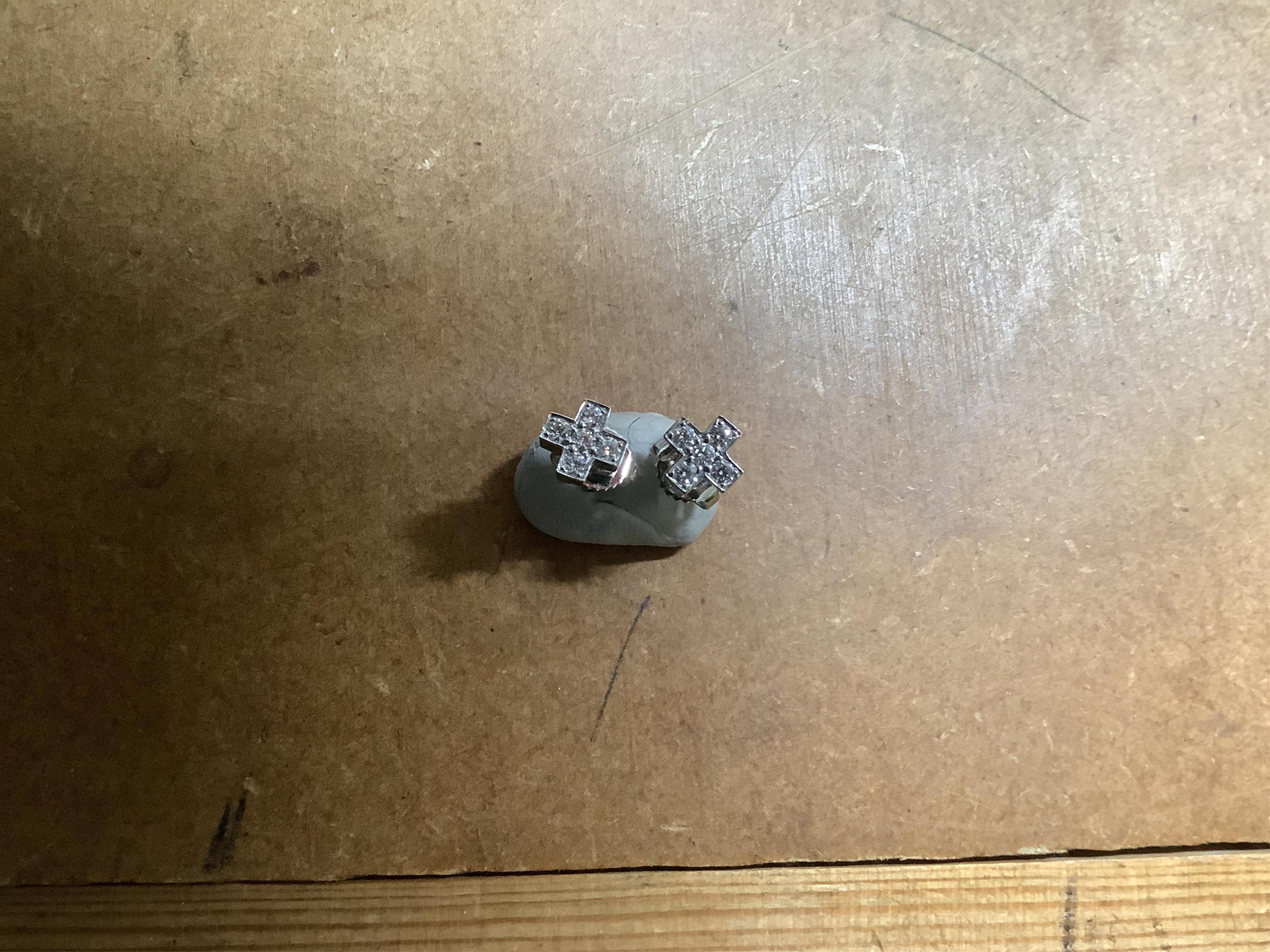 Tiffany & Co., a pair of diamond earrings and a cultured pearl necklace, the earrings of cross design, set with brilliant-cut diamonds totalling approximately 0.30 carats, mounted in platinum, length approximately 0.7cm